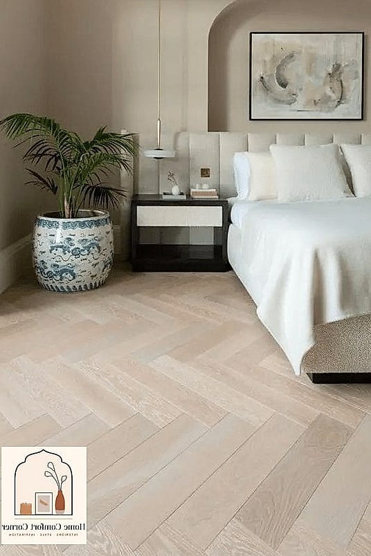 Neutral Bedroom with a Herringbone Wood Floor